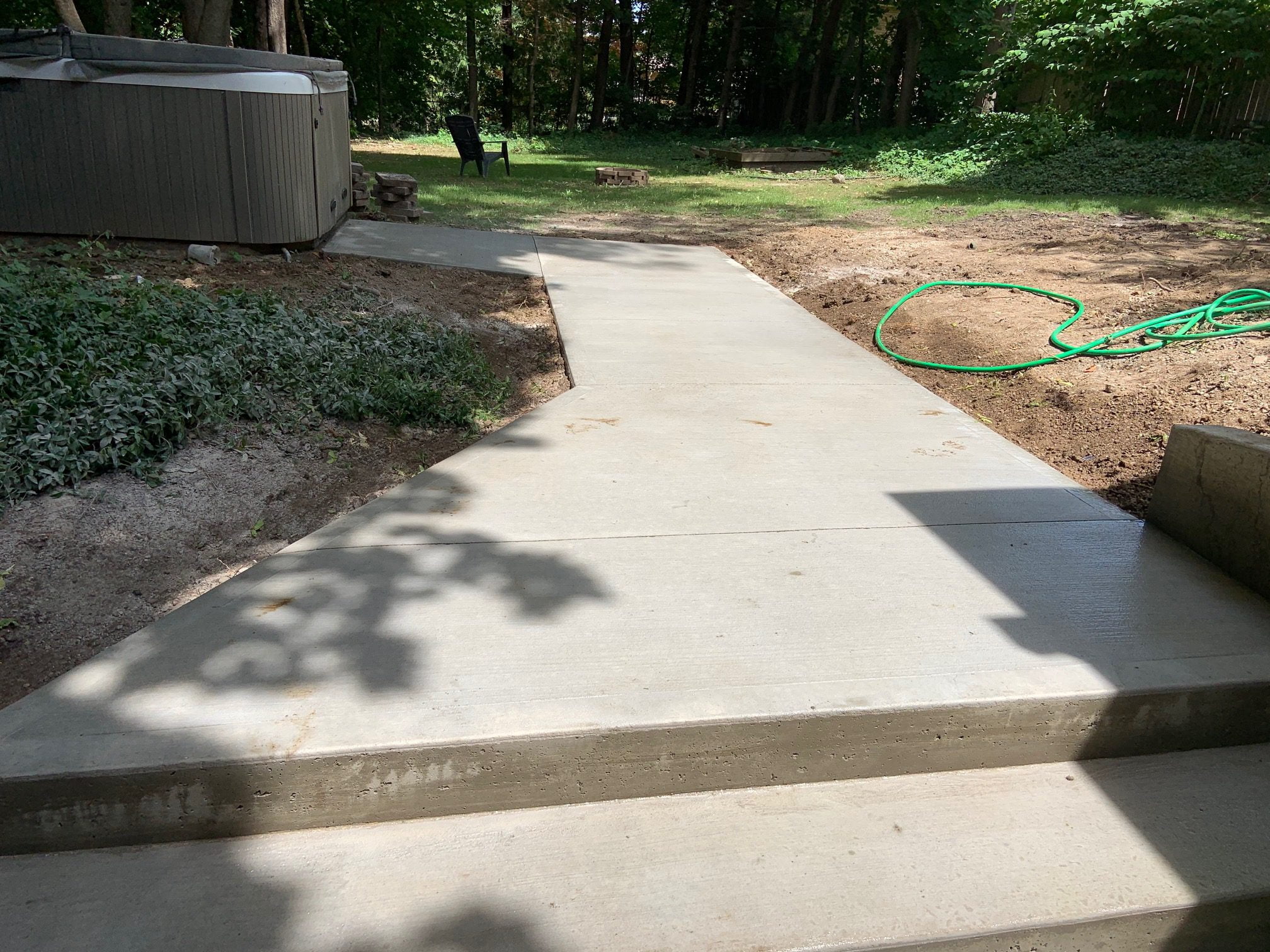 Concrete Walkway Leading To Patio